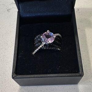 Elegant Black and Silver Ring with Purple Gemstone